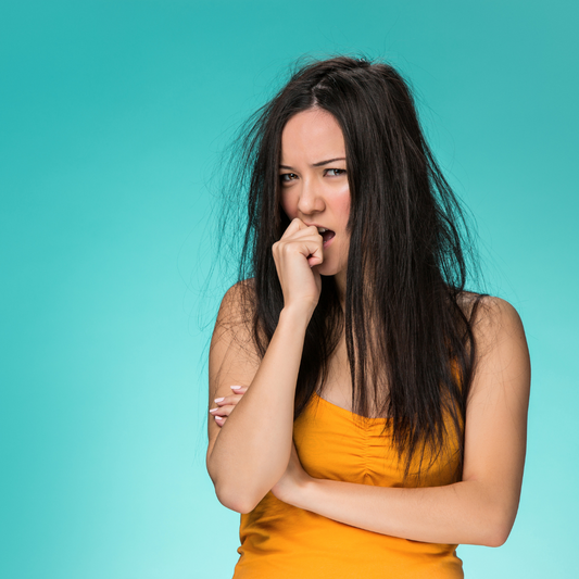 Woman with frizzy hair and anger face. She also has a question face.